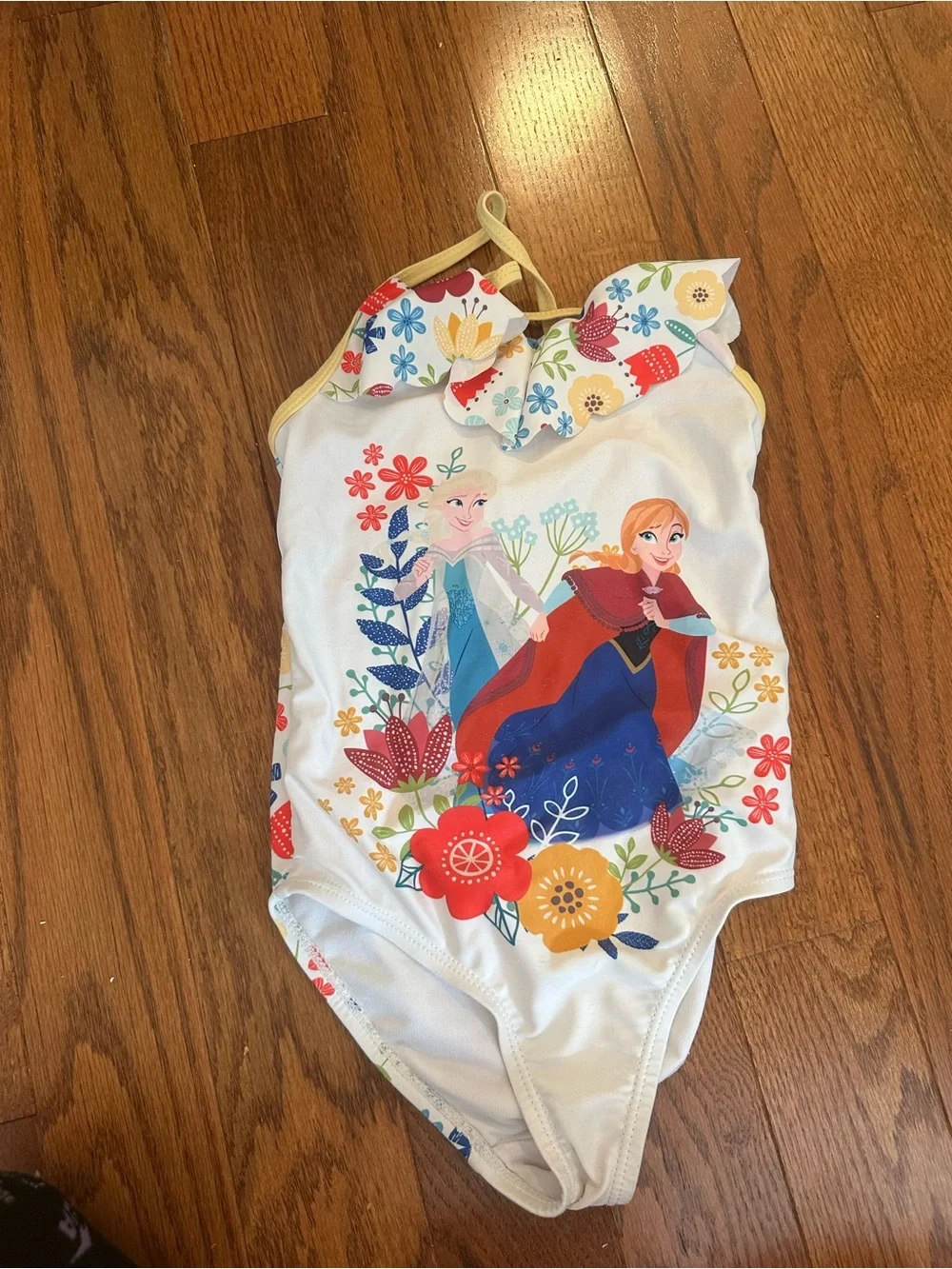 Disney White Floral Character One-Piece with Yellow Trim